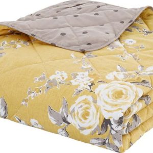 Žlutý přehoz přes postel s motivem květin Catherine Lansfield