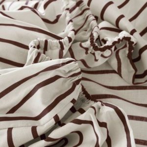 Krémové/tmavě hnědé napínací prostěradlo z bio bavlny 90x200 cm Sima – Jotex